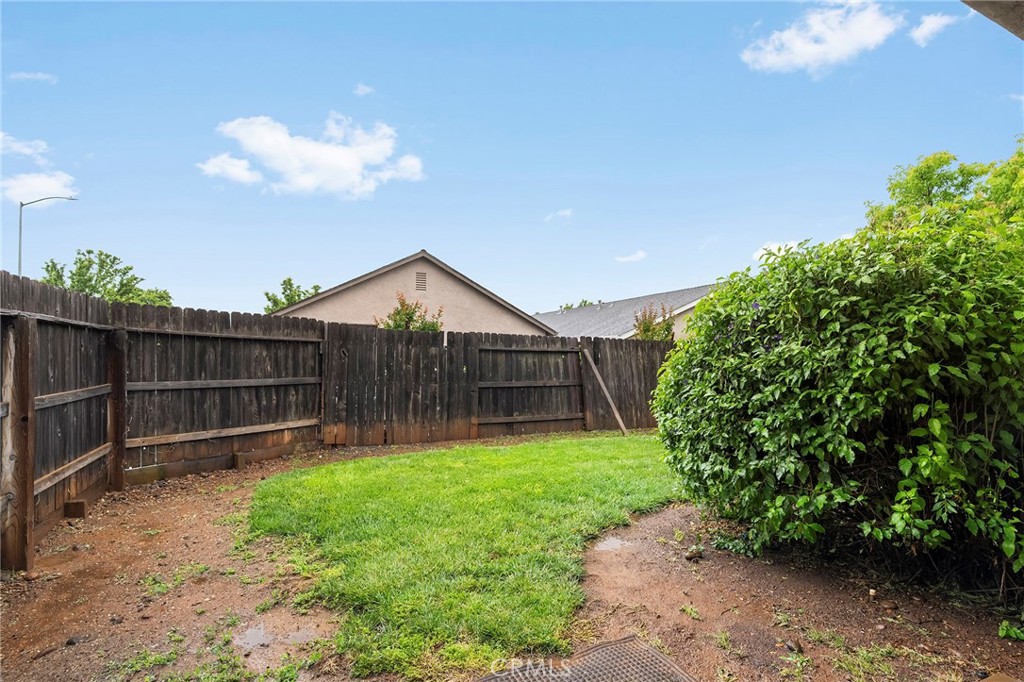 1397 Lucy Way Chico, CA 95973 - Photo 33 of 37 a view of a backyard with a garden
