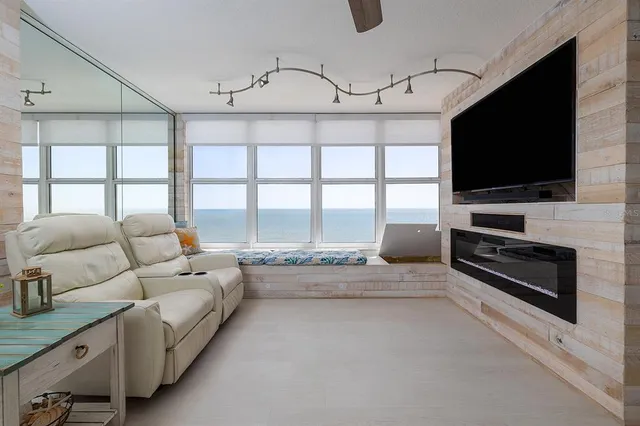 a kitchen with stainless steel appliances a refrigerator sink and microwave