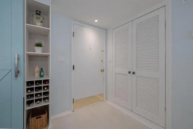 a kitchen with a sink and white cabinets