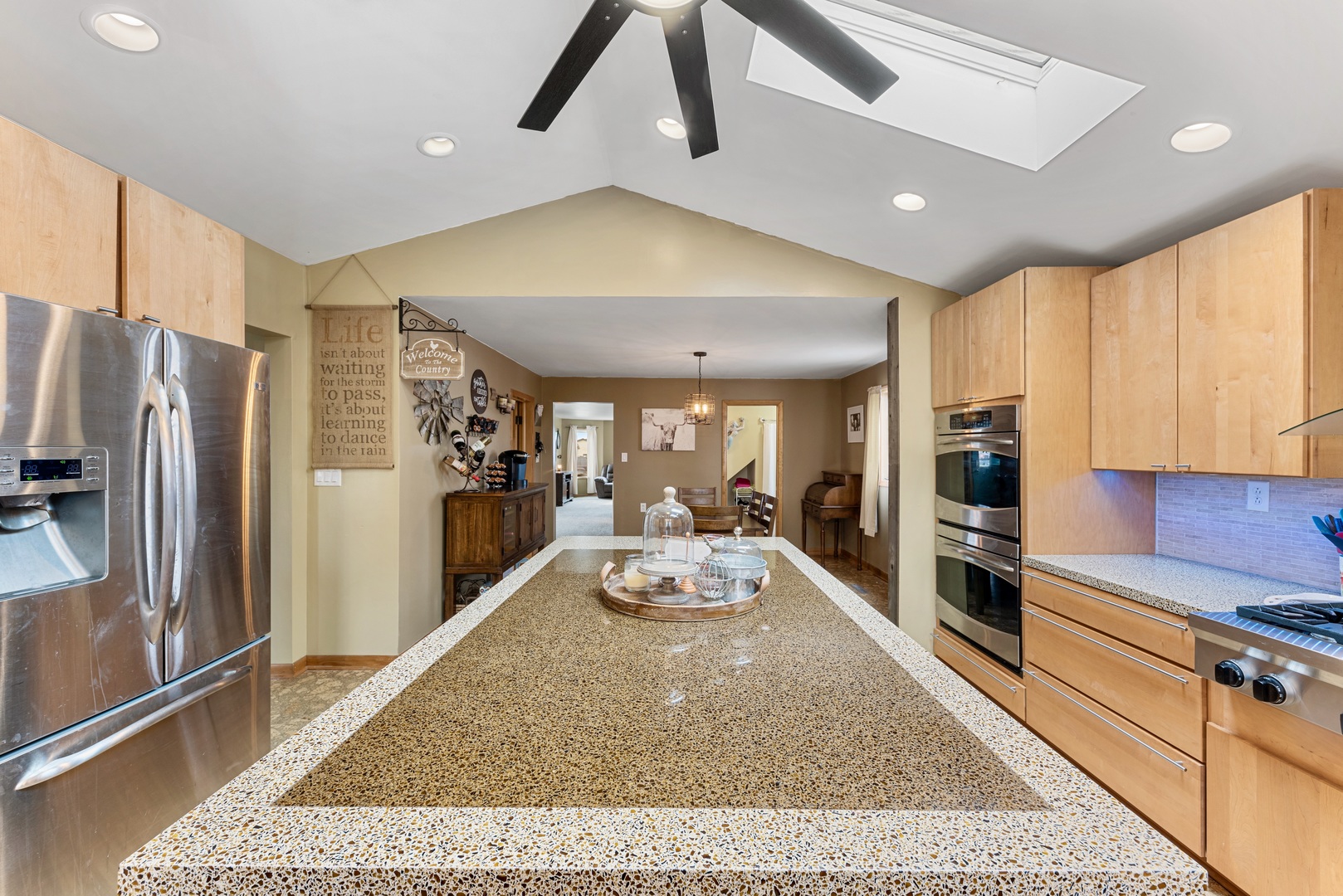 4552 Main Street Irwin, IL 60901 - Photo 11 of 37 a large kitchen with stainless steel appliances granite countertop a refrigerator oven stove a sink and dishwasher