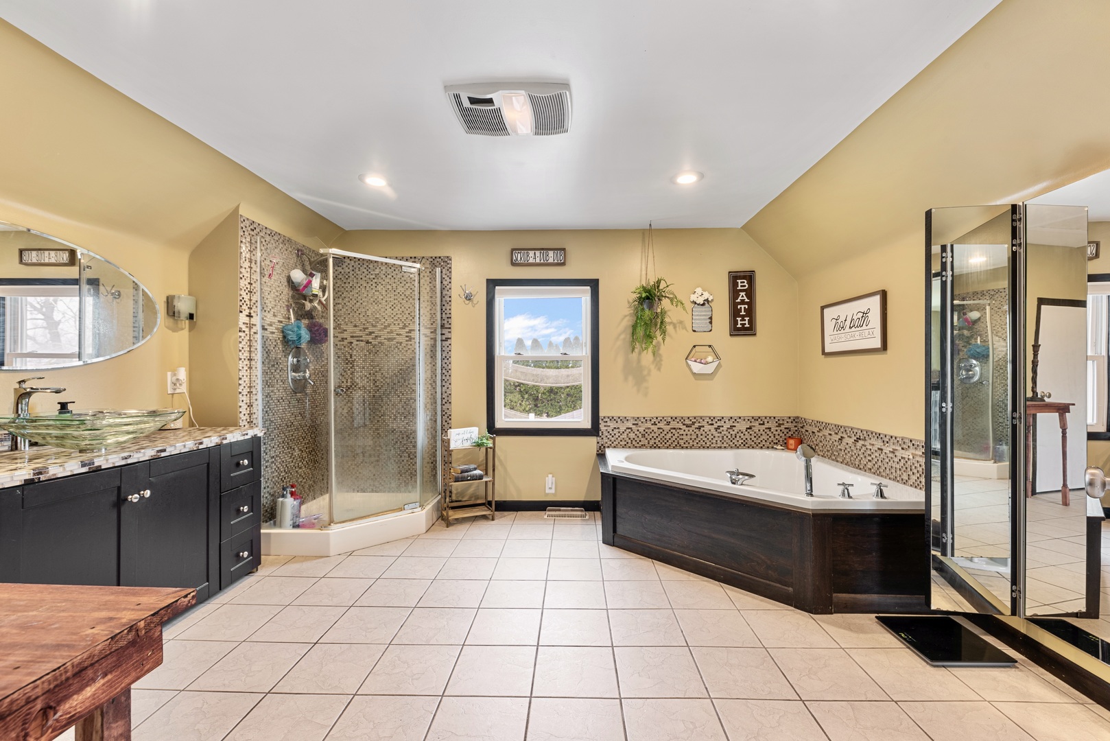 4552 Main Street Irwin, IL 60901 - Photo 18 of 37 a bathroom with a tub a sink and a shower