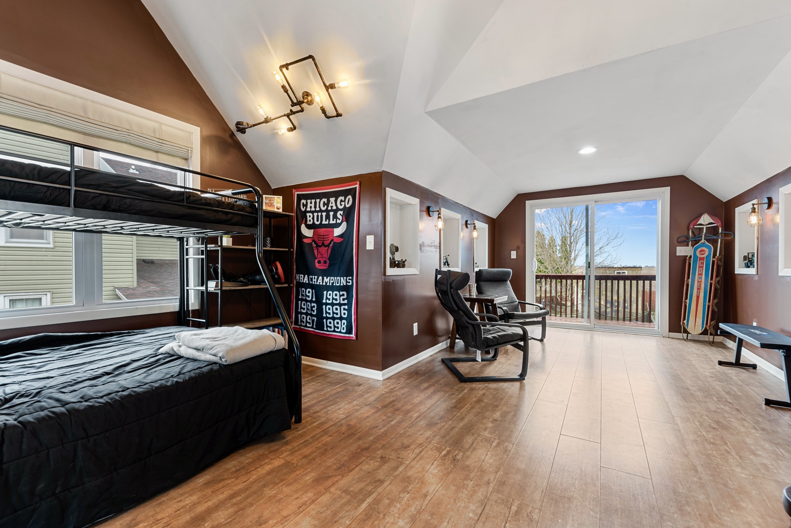 4552 Main Street Irwin, IL 60901 - Photo 21 of 37 a bed room with furniture and a flat screen tv