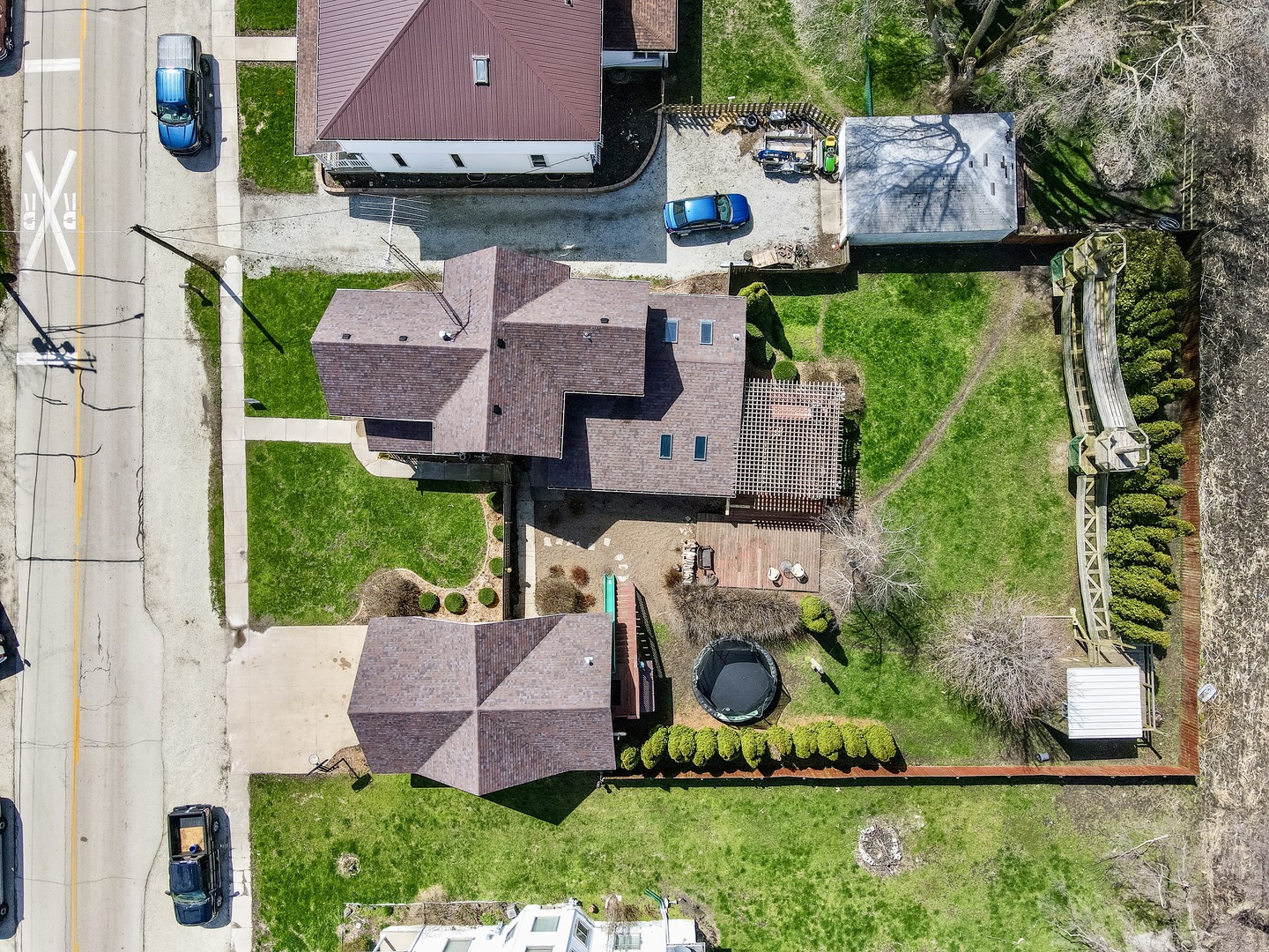 4552 Main Street Irwin, IL 60901 - Photo 34 of 37 an aerial view of a house with a garden and a yard