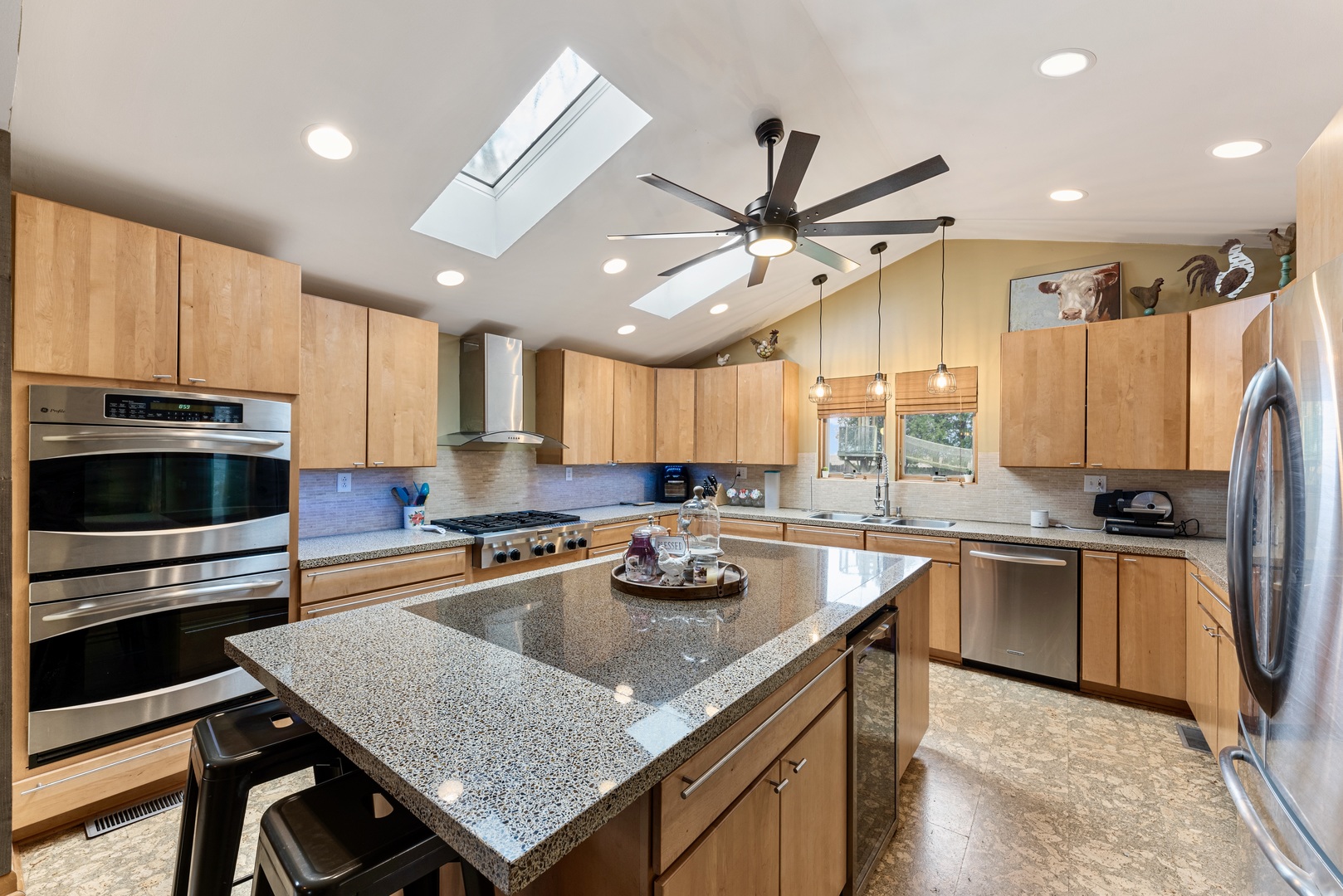 4552 Main Street Irwin, IL 60901 - Photo 10 of 37 a kitchen with stainless steel appliances granite countertop a stove refrigerator and microwave