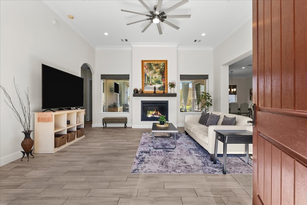 3706 Tower Road Santa Fe, TX 77517 - Photo 11 of 48 a living room with fireplace furniture and a flat screen tv