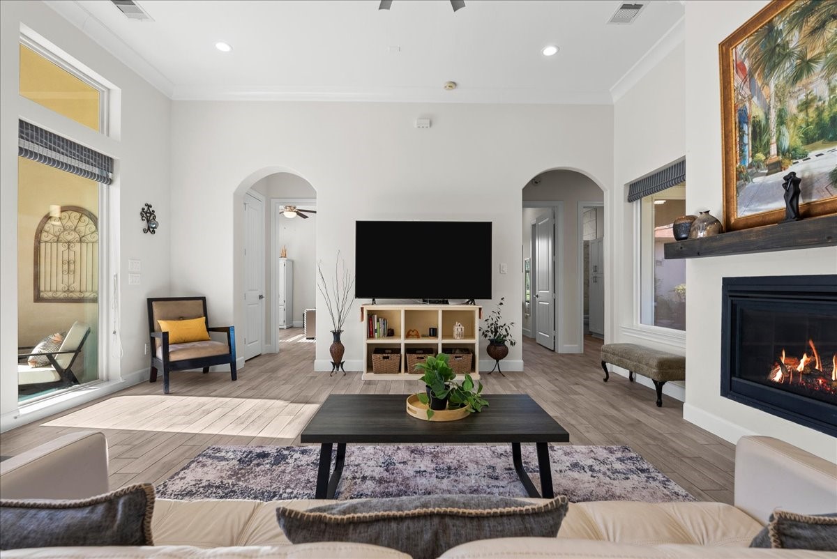 3706 Tower Road Santa Fe, TX 77517 - Photo 14 of 48 a living room with furniture a flat screen tv and a fireplace