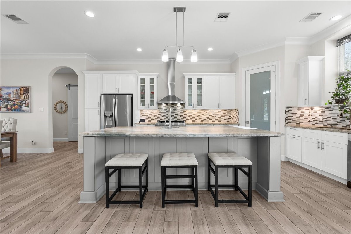 3706 Tower Road Santa Fe, TX 77517 - Photo 20 of 48 a dining room with furniture and wooden floor
