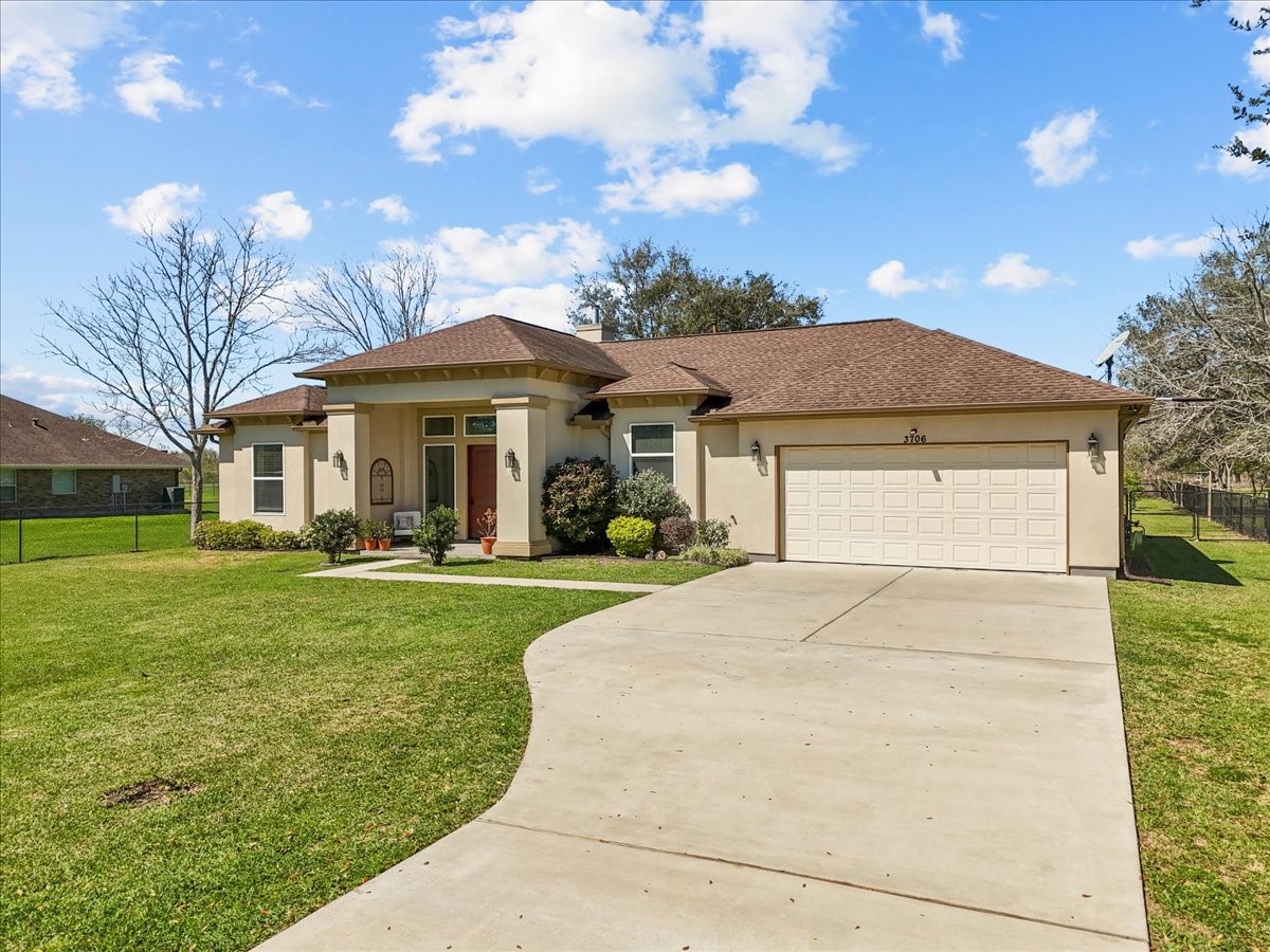 3706 Tower Road Santa Fe, TX 77517 - Photo 2 of 48 a front view of a house with a yard garden