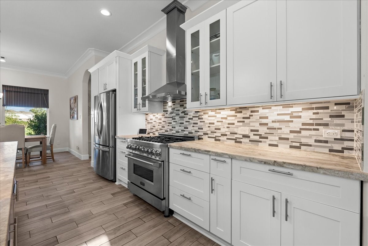 3706 Tower Road Santa Fe, TX 77517 - Photo 22 of 48 a kitchen with granite countertop a sink stainless steel appliances and cabinets