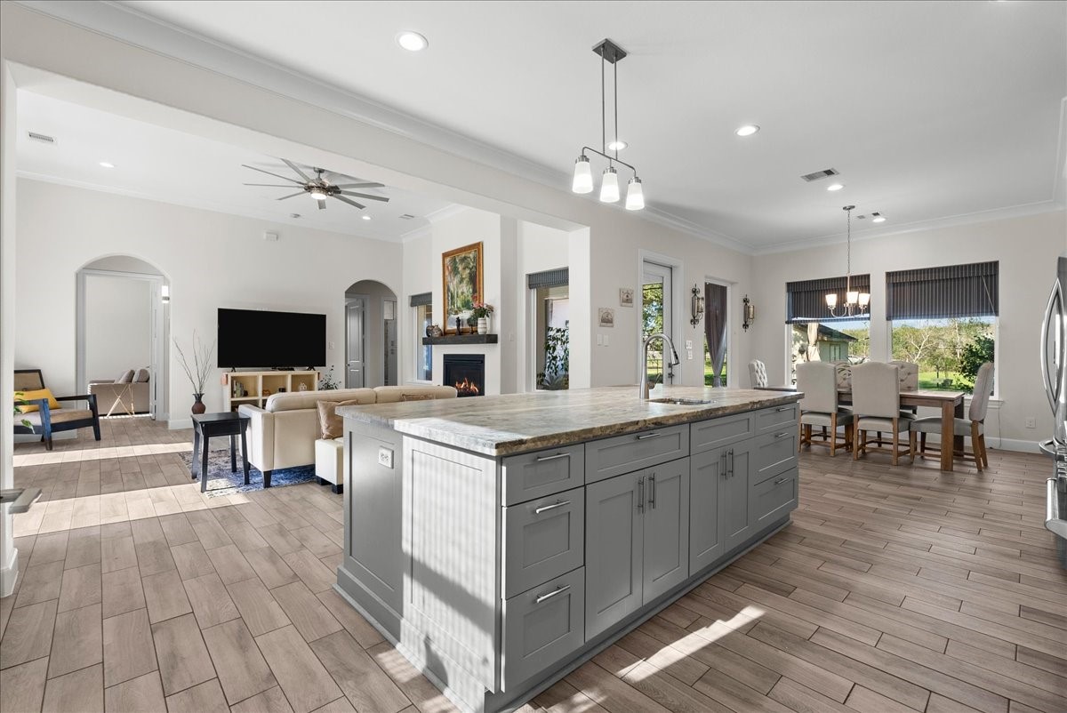 3706 Tower Road Santa Fe, TX 77517 - Photo 23 of 48 a view of living room with kitchen island furniture and flat screen tv
