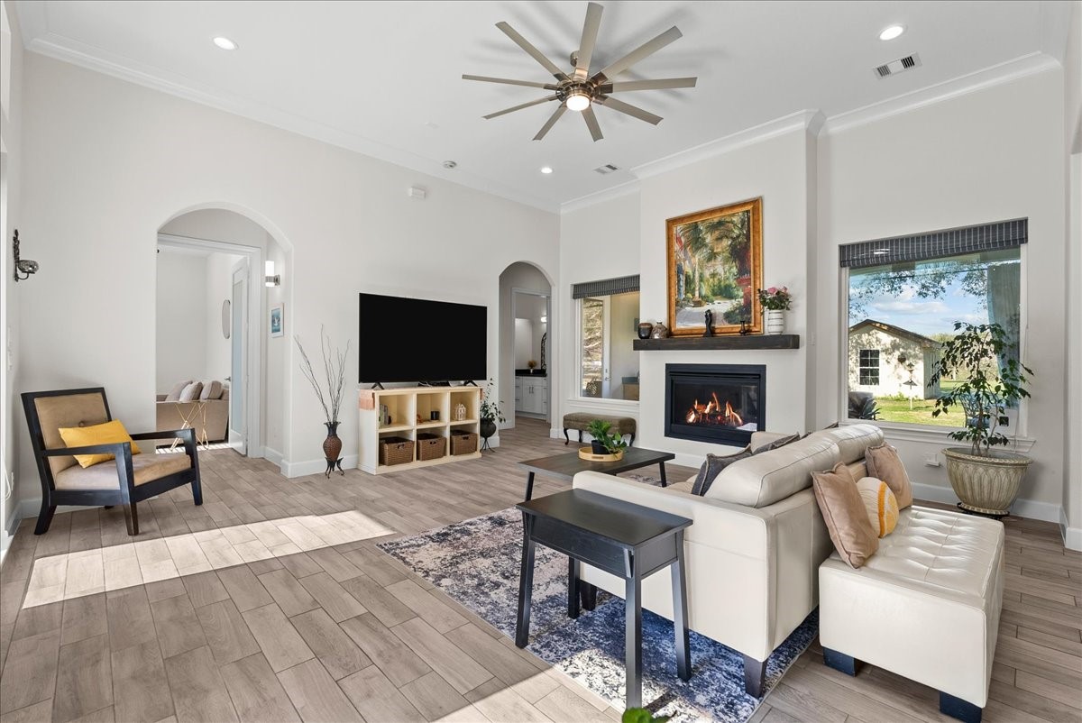 3706 Tower Road Santa Fe, TX 77517 - Photo 24 of 48 a living room with furniture a flat screen tv and a fireplace