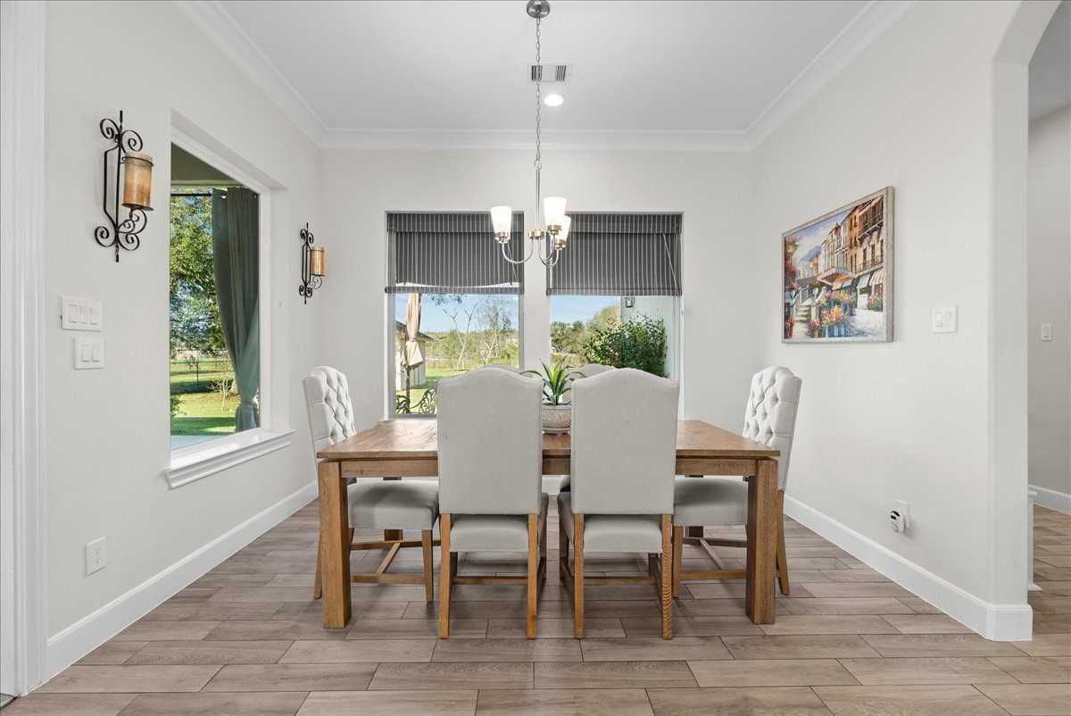 3706 Tower Road Santa Fe, TX 77517 - Photo 25 of 48 a view of a dining room with furniture window and wooden floor