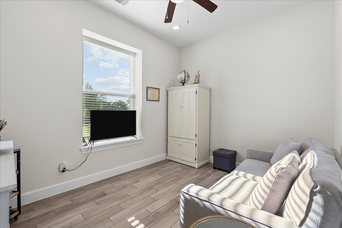 3706 Tower Road Santa Fe, TX 77517 - Photo 27 of 48 a living room with furniture and a flat screen tv