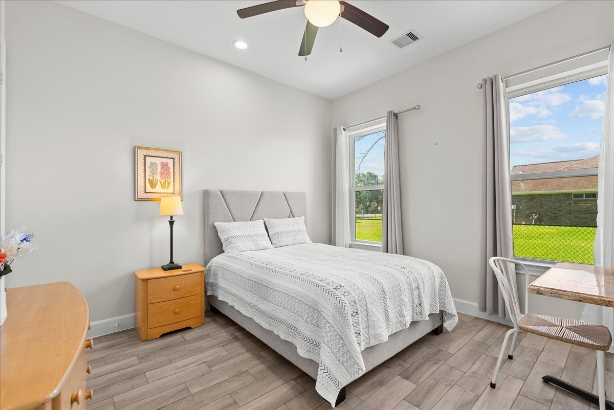 3706 Tower Road Santa Fe, TX 77517 - Photo 29 of 48 a bedroom with a bed and a chair