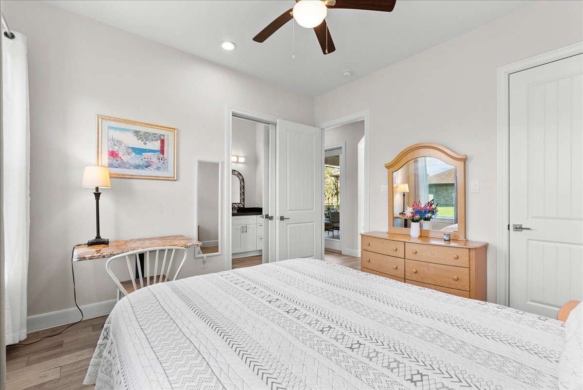 3706 Tower Road Santa Fe, TX 77517 - Photo 30 of 48 a bedroom with a large bed and a large mirror