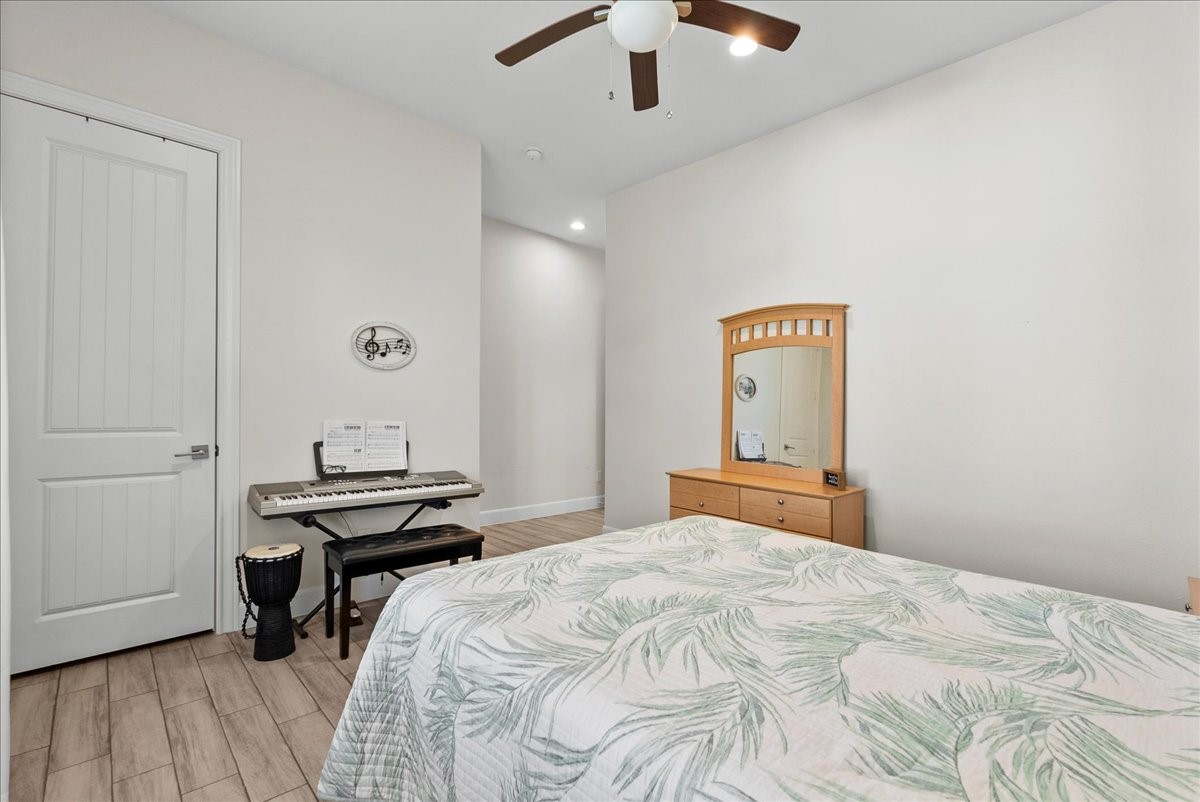 3706 Tower Road Santa Fe, TX 77517 - Photo 33 of 48 a bedroom with a bed and a dresser