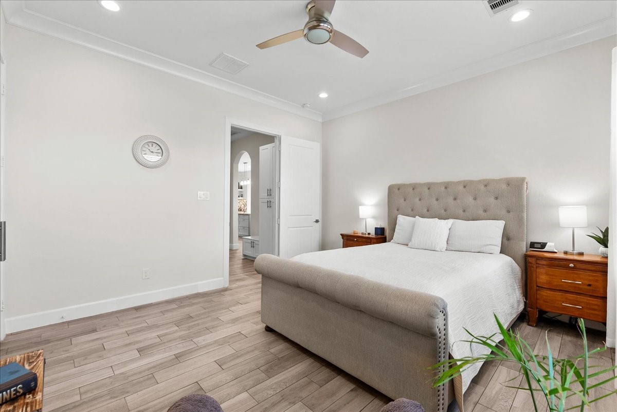 3706 Tower Road Santa Fe, TX 77517 - Photo 36 of 48 a bedroom with a bed and a chandelier