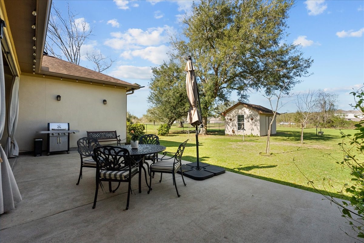 3706 Tower Road Santa Fe, TX 77517 - Photo 45 of 48 a view of a swimming pool with chair and table