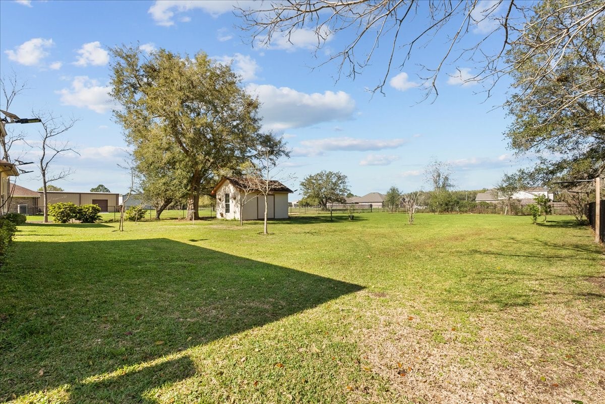 3706 Tower Road Santa Fe, TX 77517 - Photo 46 of 48 a view of yard with swimming pool and green space