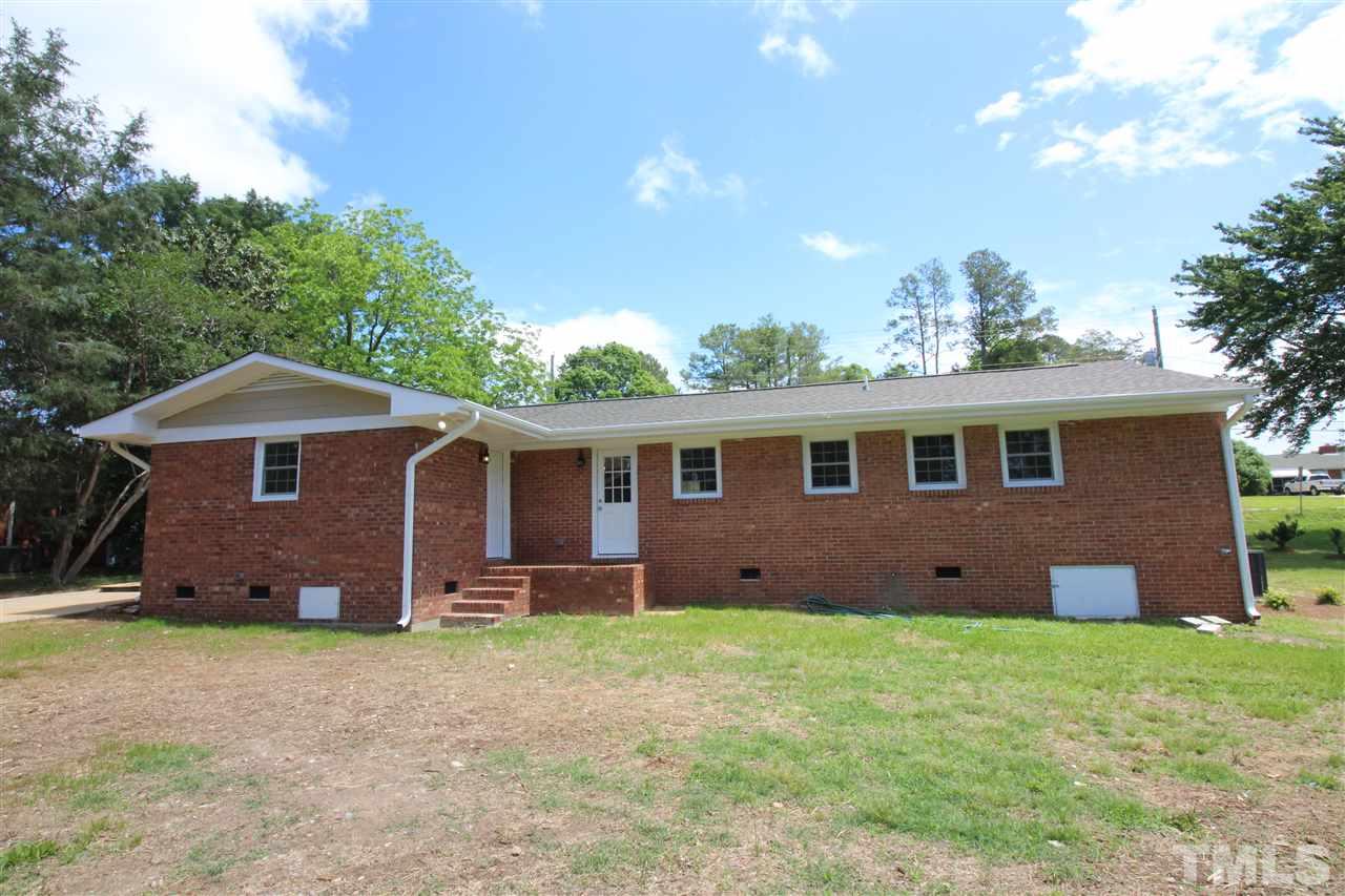 6332 Rock Quarry Road Raleigh, NC 27610 - Photo 4 of 17 a front view of a house with a garden