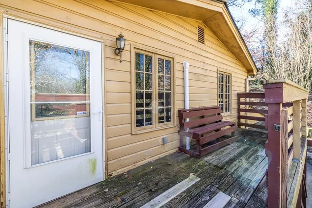 a view of a house with a door and wooden floor
