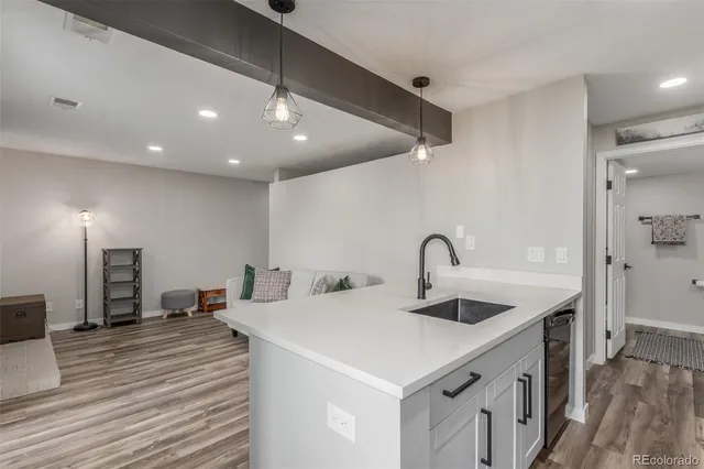 a kitchen with a sink and a refrigerator