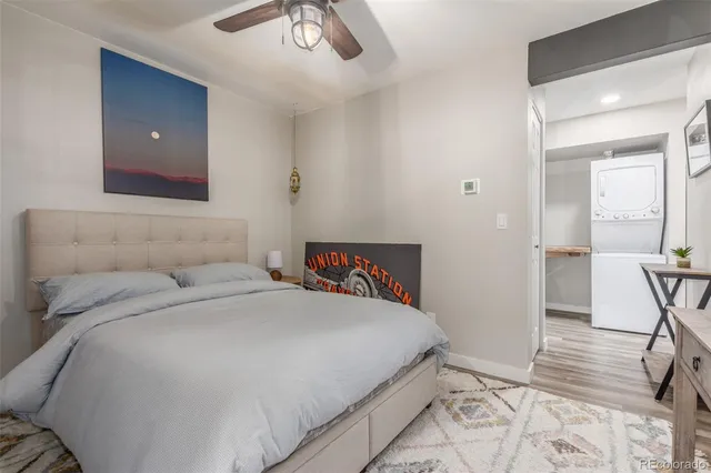 a bedroom with a bed and a chair