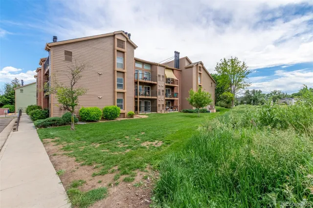 a front view of a building with garden