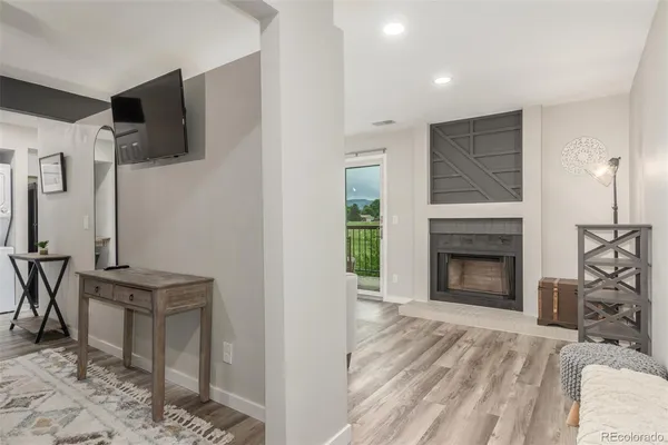 a view of a livingroom with furniture and a fireplace