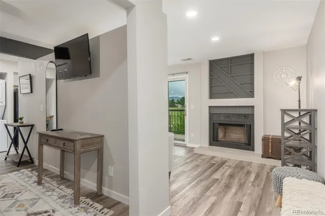 a view of a livingroom with furniture and a fireplace