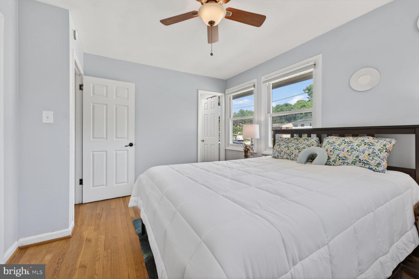 1104 Caddington Avenue Silver Spring, MD 20901 - Photo 12 of 35 a bedroom with a bed and wooden floor