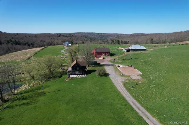 an aerial view of a house with mountain view