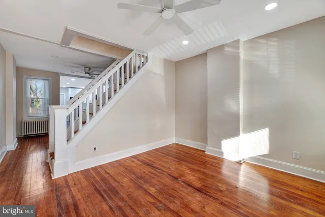 a view of an entryway with wooden floor