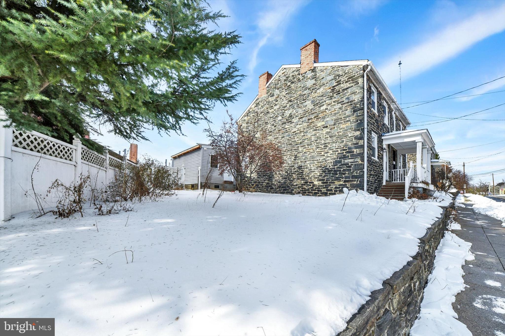 3506 Clipper Road Baltimore, MD 21211 - Photo 5 of 5 a front view of a house with a yard