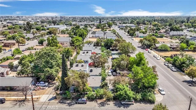 an aerial view of residential houses with city view