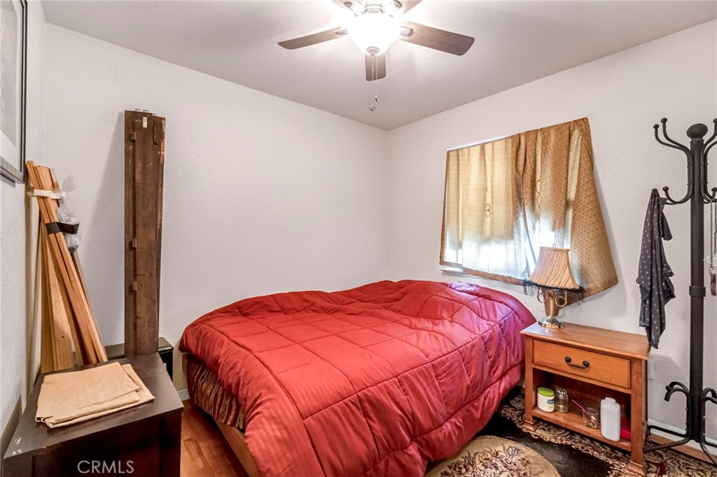 1622 B Street Fresno, CA 93706 - Photo 28 of 32 a bedroom with a bed and a flat tv screen