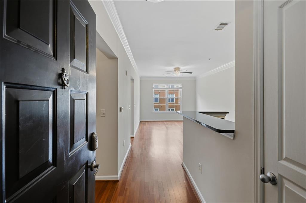 10 Perimeter Summit Boulevard, Unit 3311 Atlanta, GA 30319 - Photo 45 of 68 a view of a hallway with wooden floor and staircase