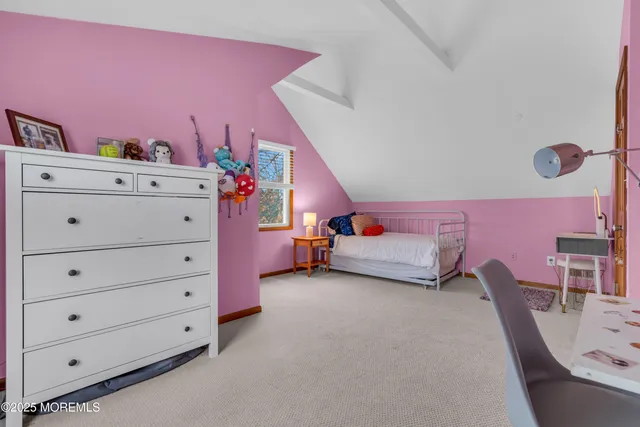 a bed room with a bed and a chair