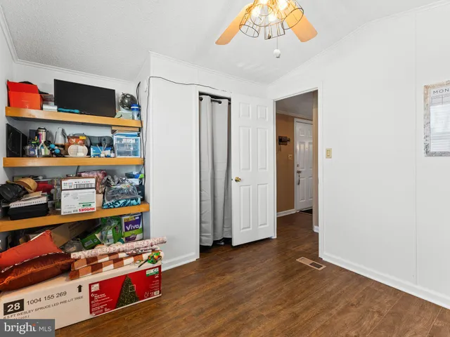 a view of room with toys and wooden floor