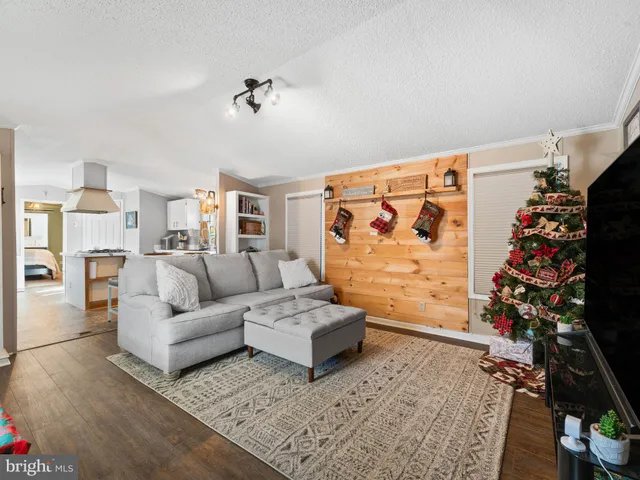 a living room with furniture and flowers
