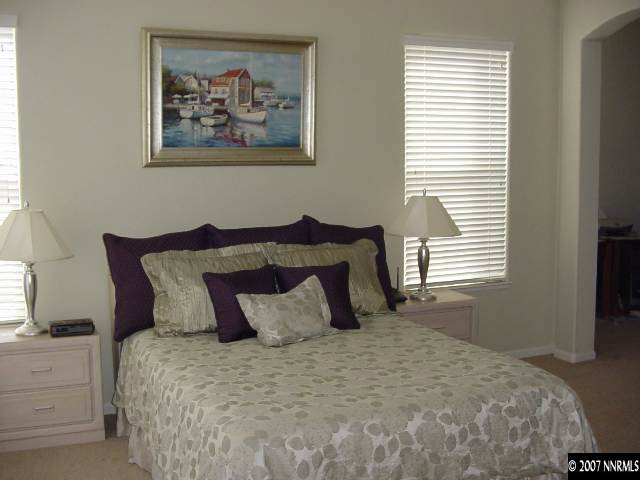 1810 Arboleda Court Reno, NV 89521 - Photo 8 of 9 a bedroom with a bed and a window