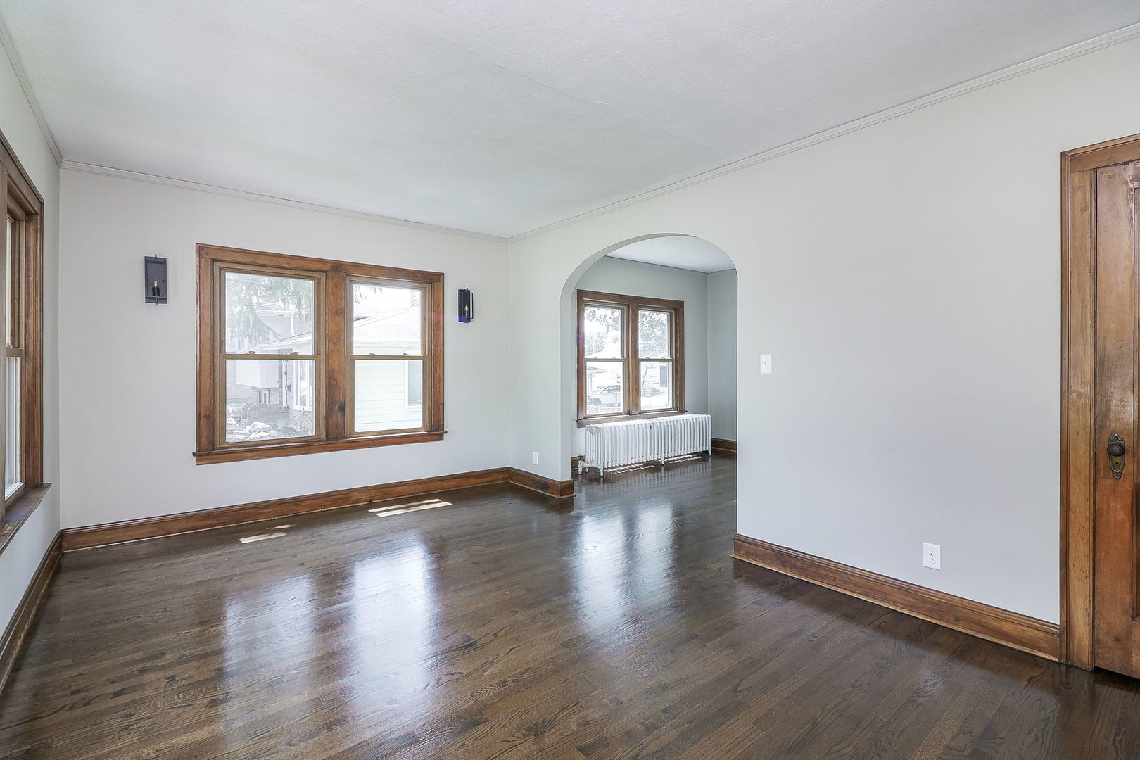 824 State Street Lemont, IL 60439 - Photo 4 of 31 a view of an empty room with wooden floor and a window