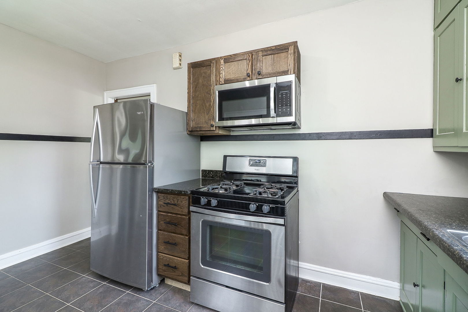824 State Street Lemont, IL 60439 - Photo 8 of 31 a kitchen with a stove microwave and refrigerator