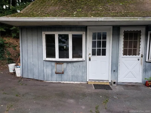 a front view of a house with a garage