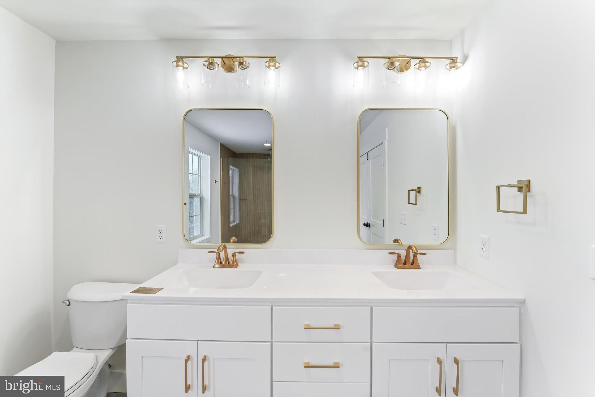 167 Ellicott Road Avondale, PA 19311 - Photo 33 of 54 a bathroom with a sink and a mirror