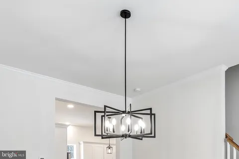 a stove top oven sitting inside of a kitchen