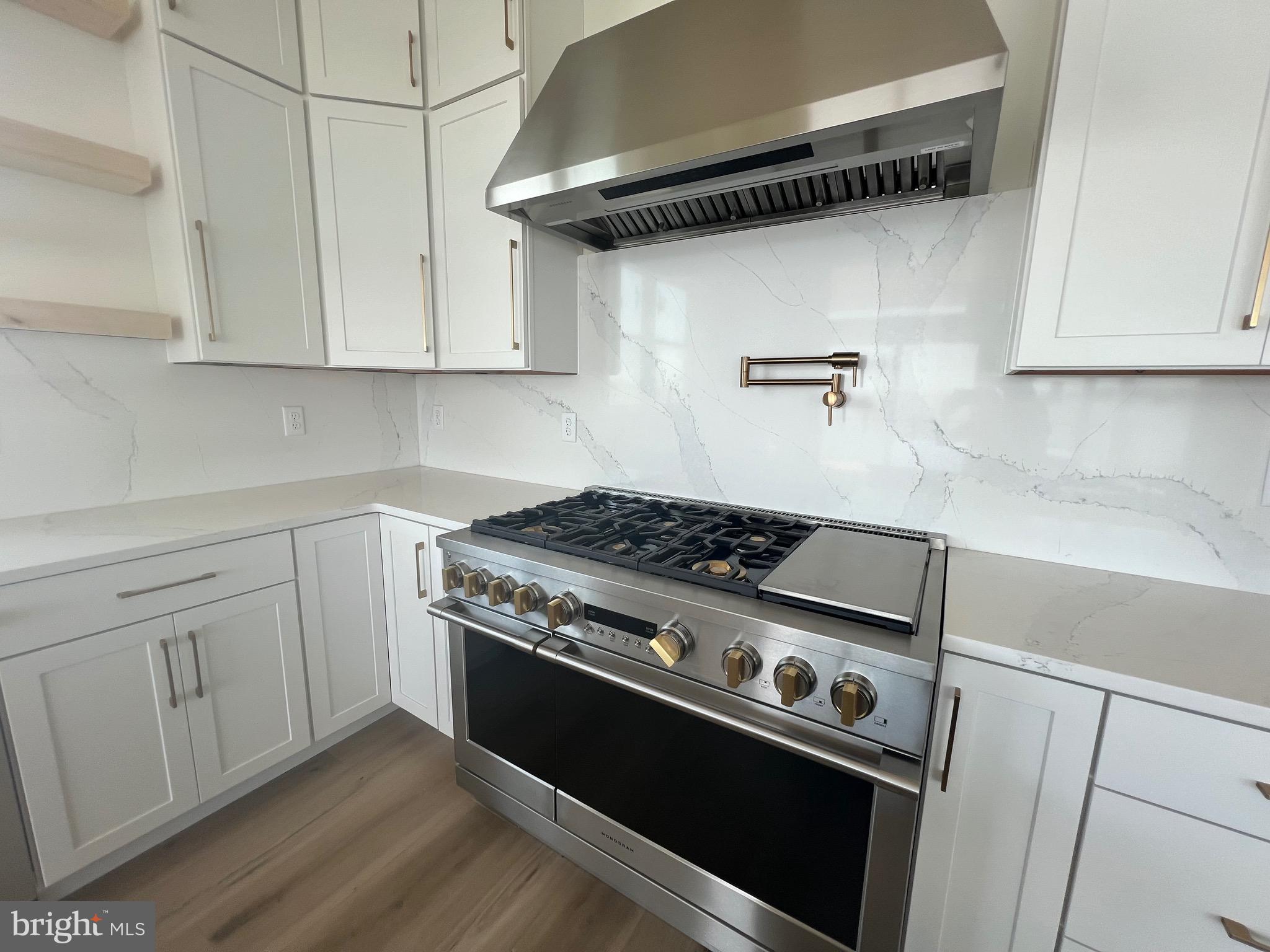 167 Ellicott Road Avondale, PA 19311 - Photo 46 of 54 a stove top oven sitting inside of a kitchen