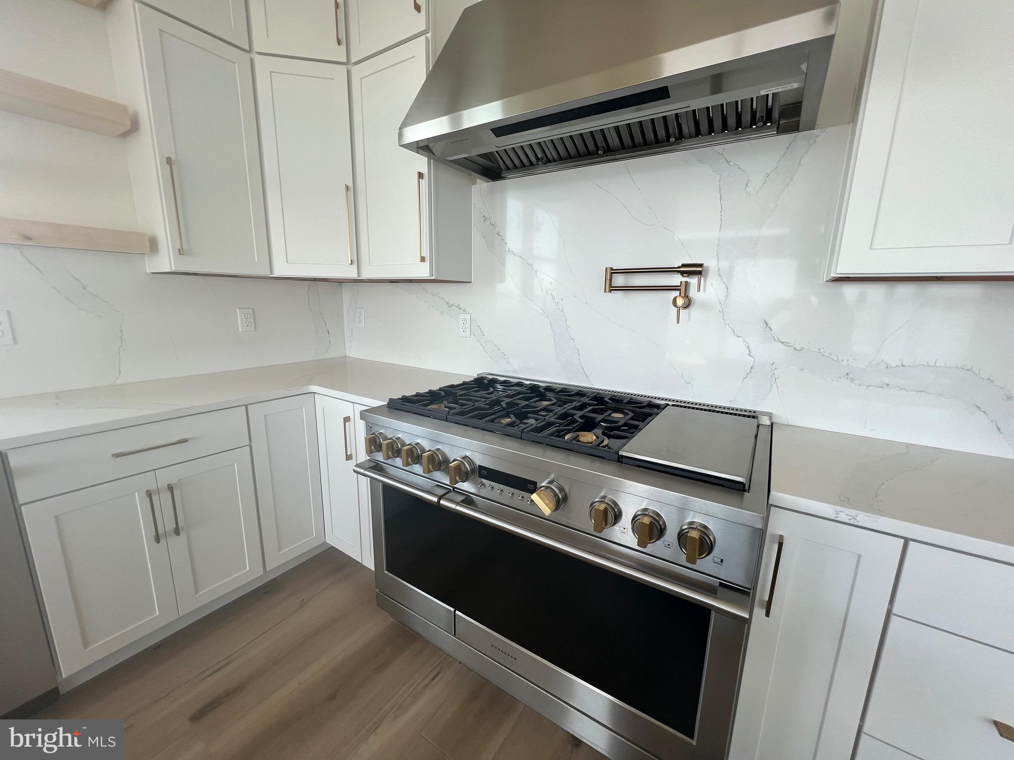 167 Ellicott Road Avondale, PA 19311 - Photo 47 of 54 a stove top oven sitting inside of a kitchen