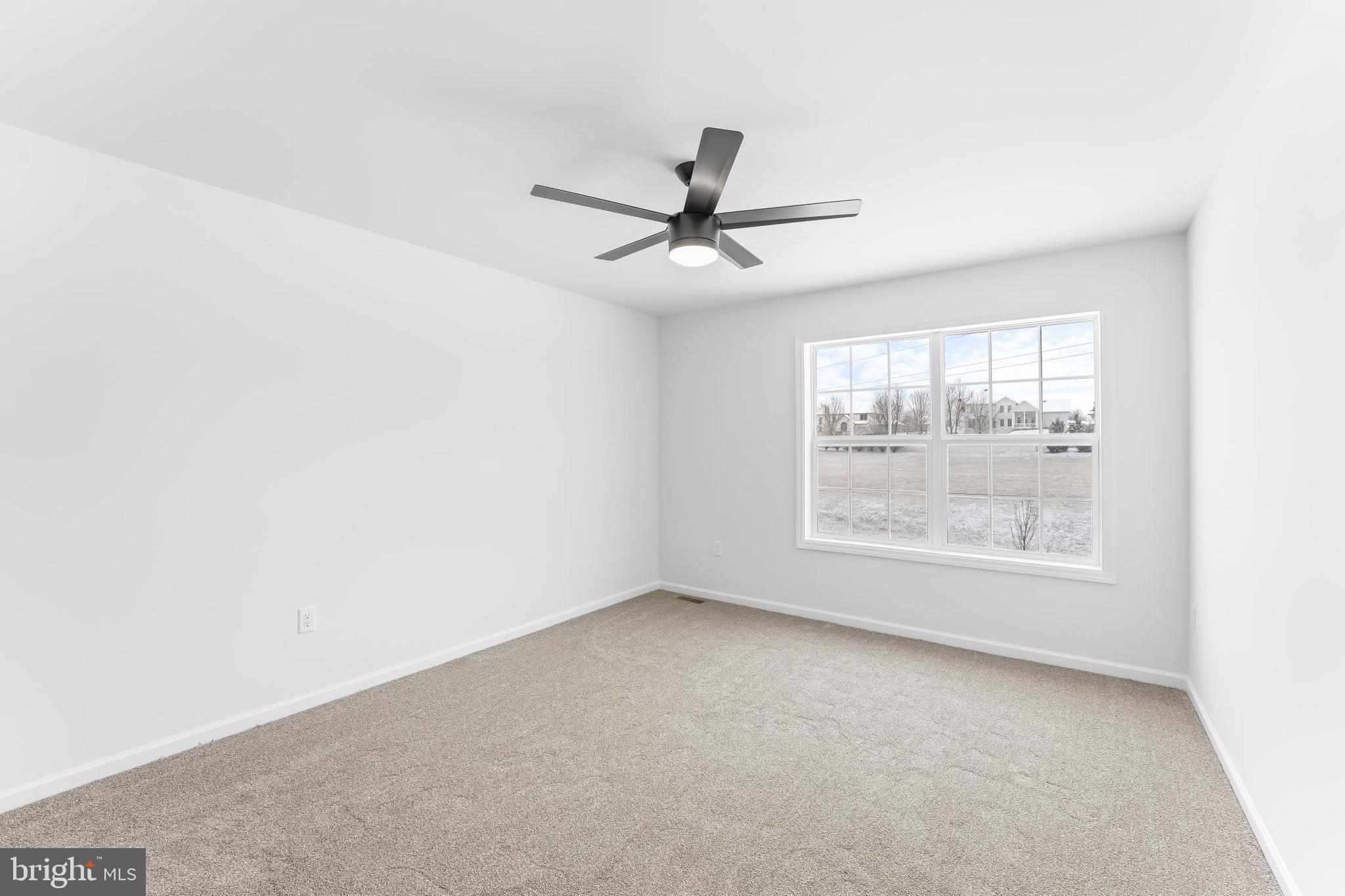 167 Ellicott Road Avondale, PA 19311 - Photo 49 of 54 an empty room with windows and fan