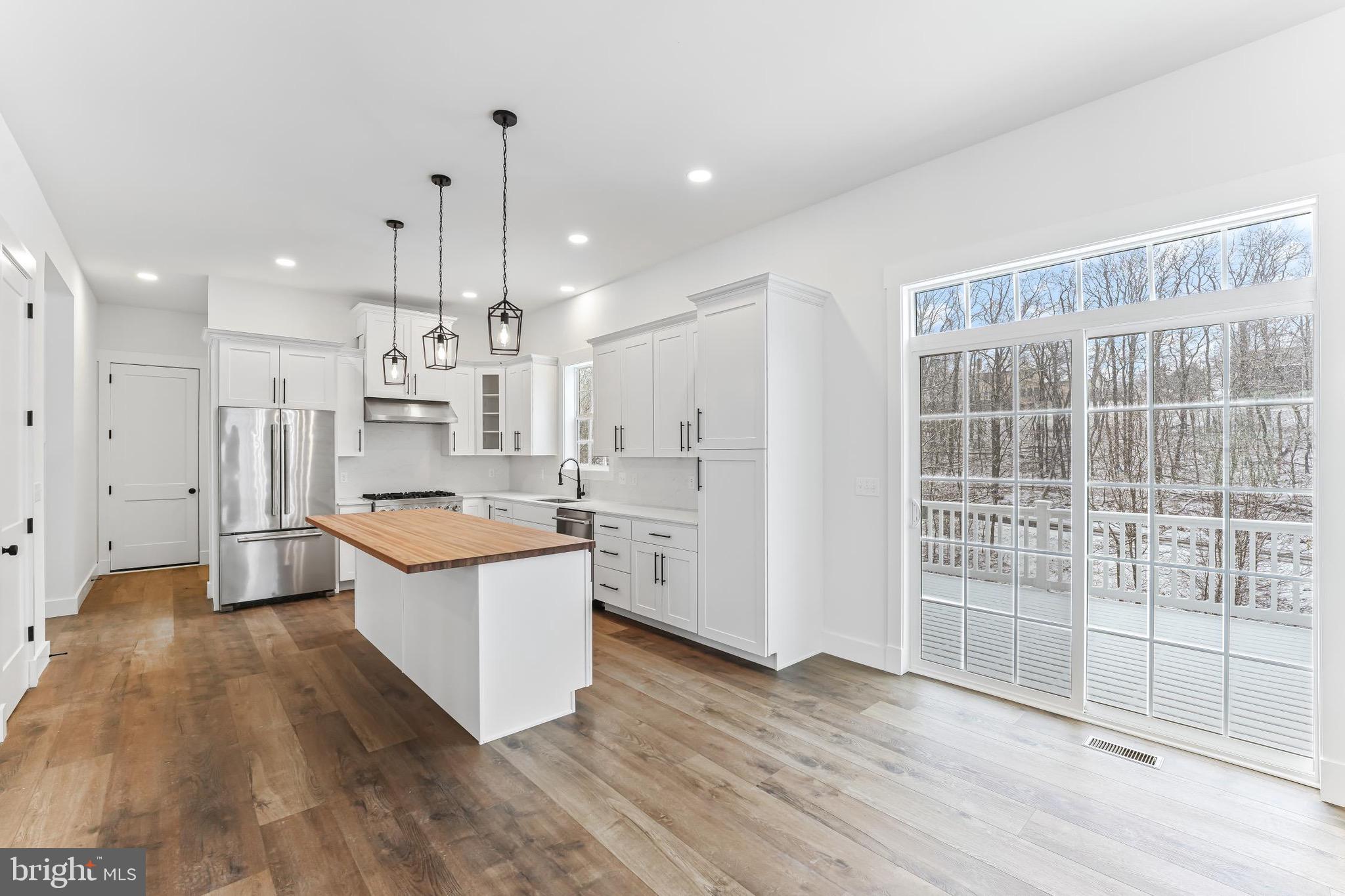 167 Ellicott Road Avondale, PA 19311 - Photo 6 of 54 a large kitchen with cabinets wooden floor and a sink